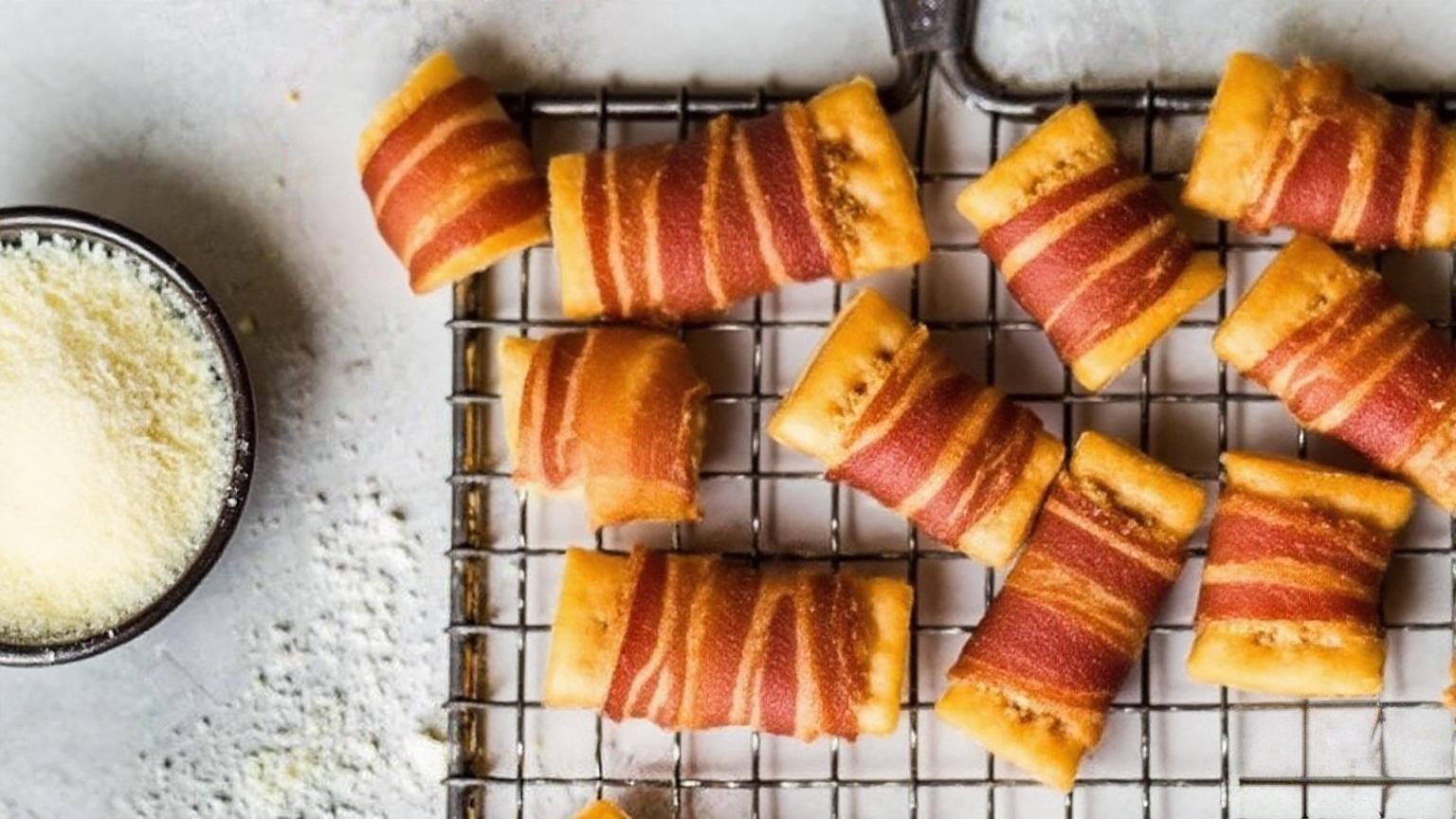 Recipe for club crackers wrapped in bacon are a simple idea that can’t be beat. Any bacon wrapped appetizers will be a hit on game day or holidays, so these are a true winner. These tasty bacon crackers won’t disappoint! Ingredients Scale 1x 2x 3x 1 sleeve or more Club Crackers I used Multi-Grain 1 lb. Pepper Bacon thin sliced is best1 lb. Pepper Bacon thin sliced is best 1 c Dark Brown Sugar my personal favorite1 c Dark Brown Sugar my personal favorite 1 c Parmesan Cheese grated other grated cheese would be good, too1 c Parmesan Cheese grated other grated cheese would be good, too Instructions Preheat the oven at 250 degrees. Cover a cookie sheet with aluminum foil. Place a cooling rack above and spray cooking on the rack. Cut the bacon in half. Crackers should be laid flat in rows on cooling racks. Put 1 teaspoon cheese and/or brown sugar on each cracker. Wrap 1/2 slices of bacon around the cracker covered with everything or sugar. (Keep in mind that cheese or sugar does not fall Found.) (If you are using a thick chopped bacon like me, to keep it together, stick a toothpick through the bacon on the top of the cracker. If using a thin bacon, I don’t think it would be necessary. I liked the paper-flavored bacon and I did not get the thin chopped paper. Bacon-ripped crackers on the rack above the cookie Sheet keep Keep the cookie sheet in the oven with crackers. Bake for 2 hours at 250 degrees. If necessary, brief the crackers for only 1-2 minutes to end the bacon crisp and caramelies. Look closely or the sugar will burn quickly. Remove from the oven and cool enough to eat. Enjoy !! Notes These crackers freeze very well. Cool completely, then place it in a freezer bag. When ready to eat, remove from the freezer and let it melt in the bag itself. Preheat the oven at 250 degrees and bake for 15-20 minutes or until the bacon is hot and sizzling.