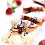 This strawberry banana breakfast quesadilla is your favorite childhood sandwich totally remixed quesadilla style. Whether you have it for breakfast, lunch or dessert your childhood cravings will totally thank you.